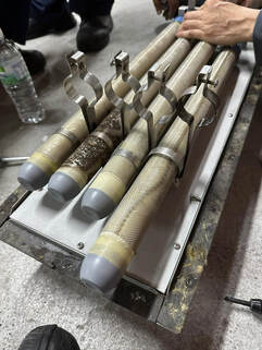 Multi-Core Composite ionization tubes showing signs of charring and smoldering from a Singapore installation.