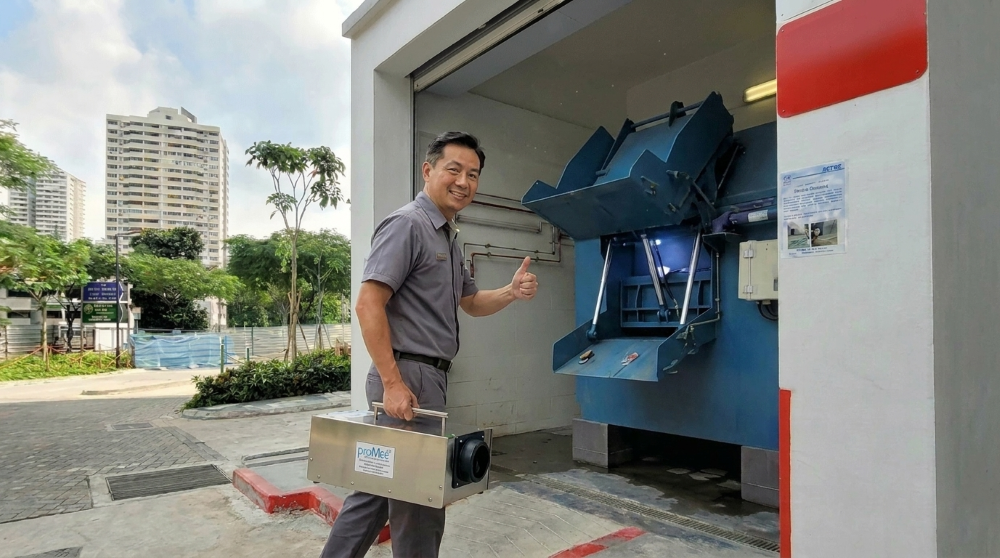 A facility manager at a Singapore bin centre with the UV SG-7000T36 Pro ozone generator. Treatment takes under two hours — no installation required. ProMedUSA has been solving Singapore's toughest bin centre odour problems since 2006